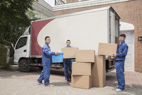 Moving van and packed household boxes for a Roehampton home move