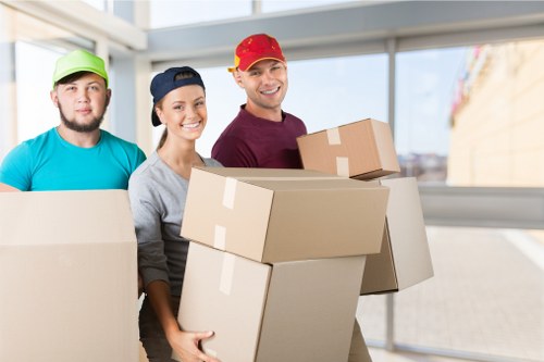 Moving team protecting furniture during a safe removal job