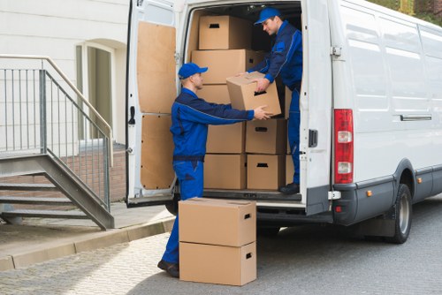 Professional movers handling furniture during a local house removal
