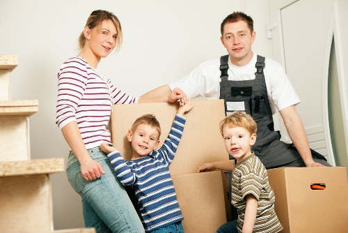 Professional removal van loading furniture and boxes in Roehampton