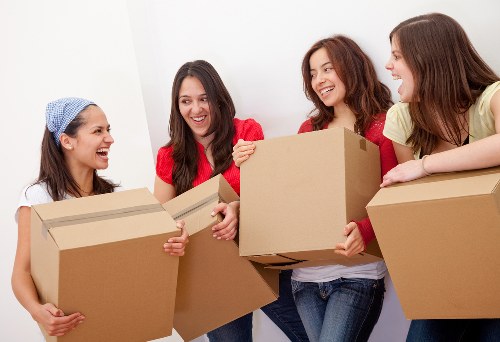Packed moving boxes ready for a family relocation in Roehampton