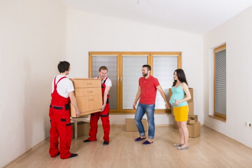 Careful loading of household items into a van for local transport