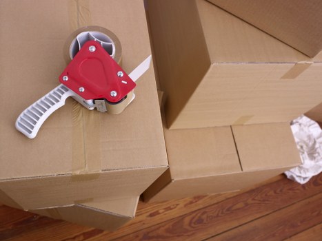 Careful unloading of household furniture at a Roehampton property