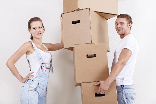 Local moving team handling boxes and furniture in Roehampton