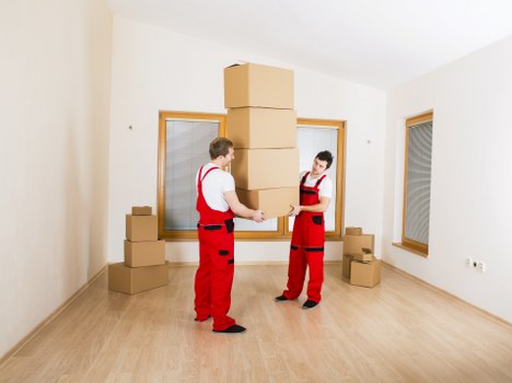 Packed boxes and furniture ready for local transport