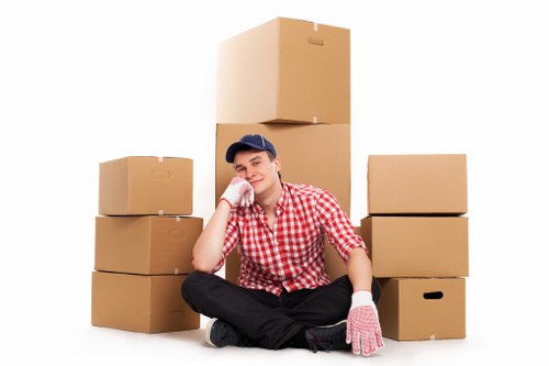 Professional movers handling furniture for a South West London relocation